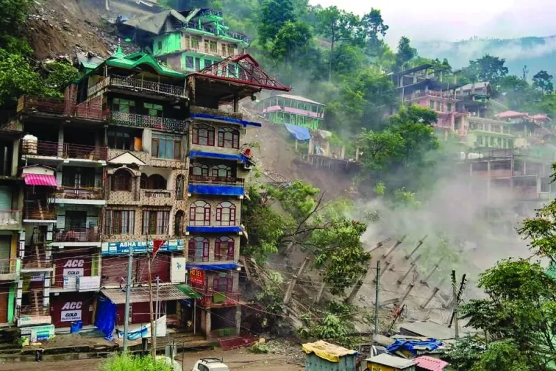 Several buildings collapsed after massive landslides following heavy rainfall at Kullu’s Anni town, in India’s Himachal Pradesh state, on Thursday.