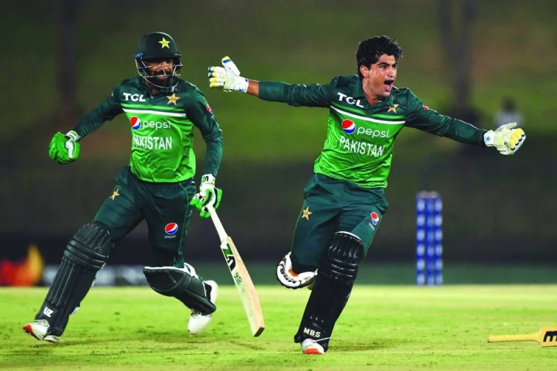 Pakistan’s Naseem Shah (right) and Haris Rauf celebrate after Pakistan won by one wicket during the second one-day international (ODI) against Afghanistan in Hambantota on Thursday. (AFP)