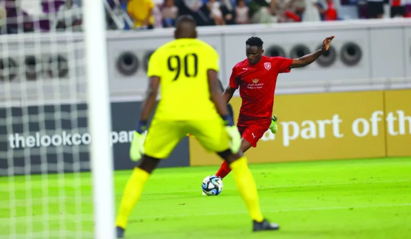 
Al Duhail’s Michael Olunga scores against Muaither during the the Expo Stars League match at the Khalifa International Stadium. 