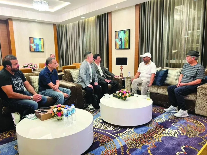 Khalil al-Mohannadi, and Chairman of the Appointments Committee Abdullah Yousuf al-Mulla, during a meeting at the same Summit.