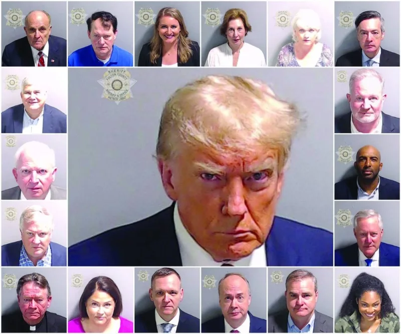 
This combination picture shows police booking mugshots of former US president Donald Trump and the 18 people indicted with him: Rudy Giuliani, Ray Smith, Jenna Ellis, Sidney Powell, Cathy Latham, Kenneth Chesebro, David Shafer, John Eastman, Scott Hall, Harrison Floyd, Mark Meadows, Trevian Kutti, Shawn Still, Jeffrey Clark, Michael Roman, Misty Hampton, Stephen Cliffgard Lee, and Robert Cheeley. 