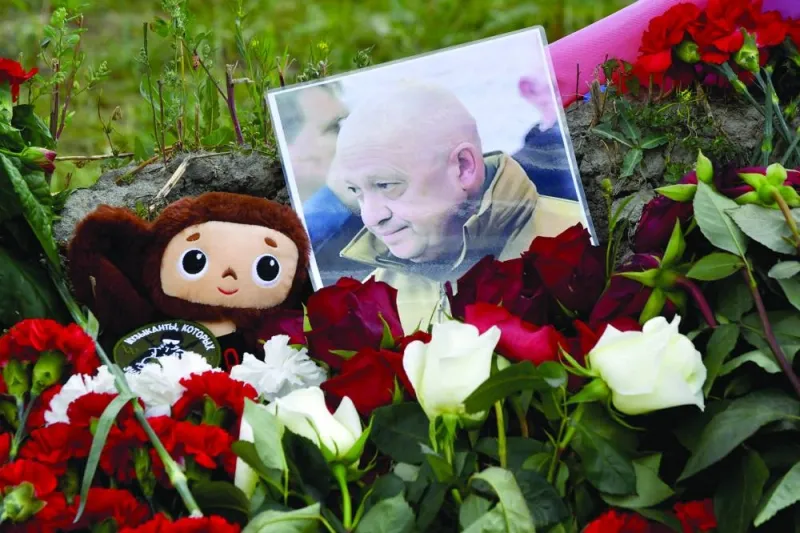 
A portrait of Yevgeny Prigozhin is seen amid flowers at a makeshift memorial in front of the Private Military Company (PMC) Wagner Centre in Saint Petersburg. 