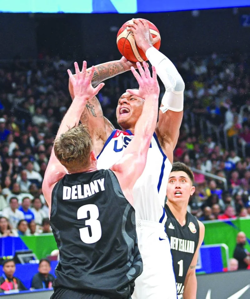 US’ Paolo Banchero (right) takes a shot as New Zealand’s Dinn Delany defends during the FIBA Basketball World Cup Group C at the Mall of Asia Arena in Manila on Saturday. (AFP)