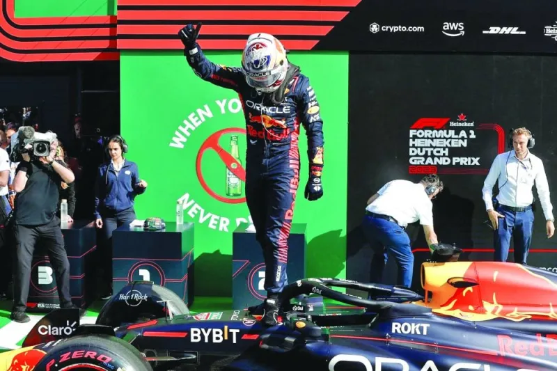 Red Bull Racing’s driver Max Verstappen celebrating taking pole position in the parc ferme after the qualifying 
session at The Circuit Zandvoort on Saturday, ahead of the Dutch Formula One Grand Prix in Zandvoort. (AFP)
