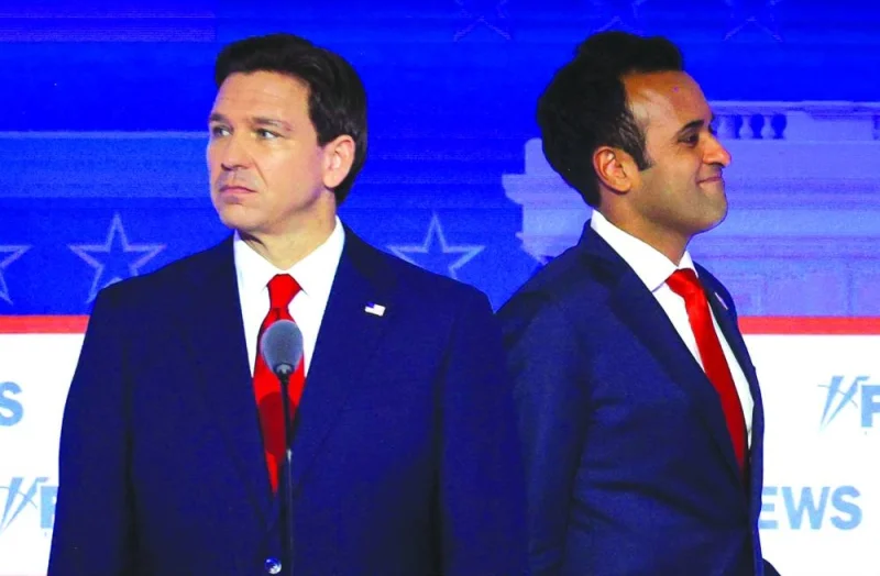 
Ramaswamy walks past DeSantis during a break at the first Republican candidates’ debate of the 2024 US presidential campaign in Milwaukee. 