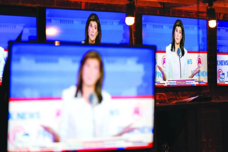 
Haley is seen on television screens at a watch party at a nightspot in Washington, DC for the first 2024 Republican presidential primary debate. 