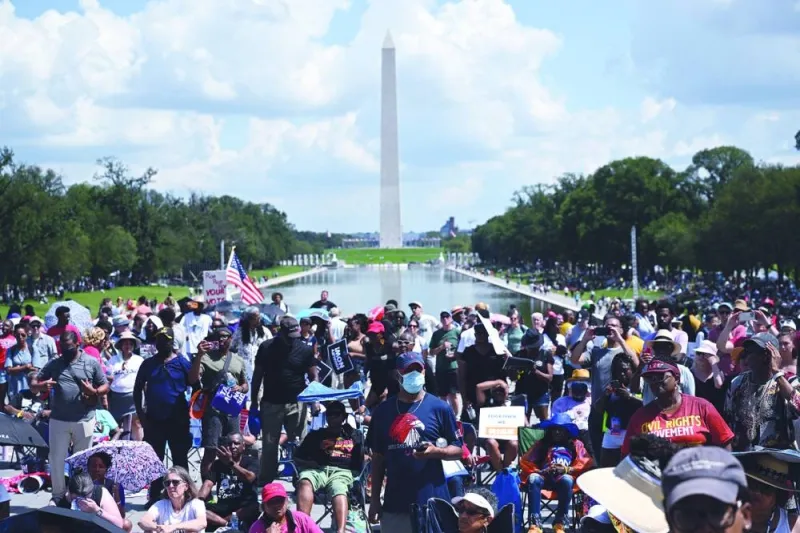 
People participate in the 60th anniversary of the civil rights March On Washington. 
