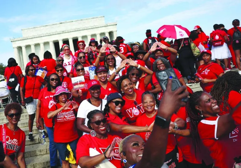 
Left: Members of the Delta Sigma Theta Sorority gather for a photo at the 60th anniversary of the March on Washington at the Lincoln Memorial. 