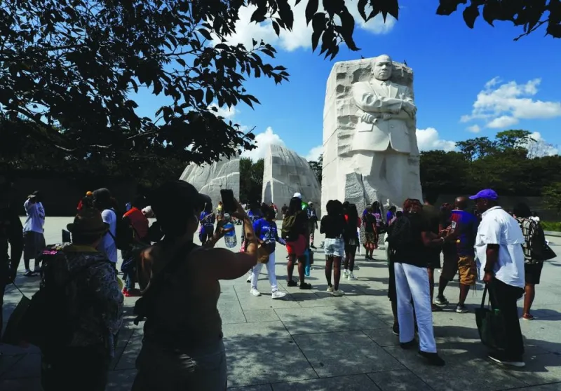 
Left: People gather at Martin Luther King, Jr. Memorial. 
