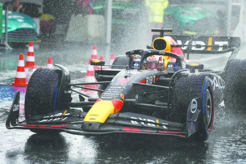 Red Bull Racing’s Dutch driver Max Verstappen drives to the pit under the rain during the Dutch Formula One Grand Prix at the Circuit Zandvoort on Sunday. (AFP)