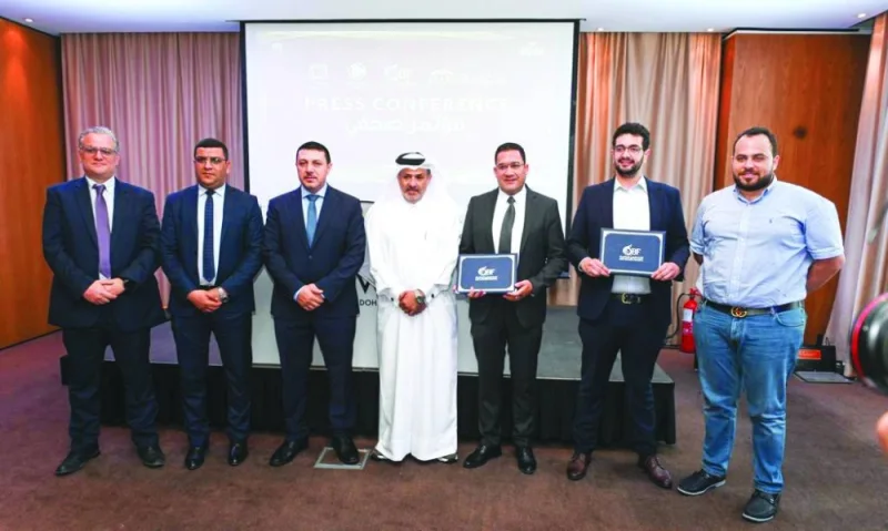 Saadoun Sabah al-Kuwari, secretary-general of Qatar Basketball Federation, is joined by Founder, Beyond Sports/Beyond Perspective, Ahmed Kazwini; General Manager, Elite Motors, Mohamed Subaei: and other officials at a sponsorship signing ceremony in Doha.