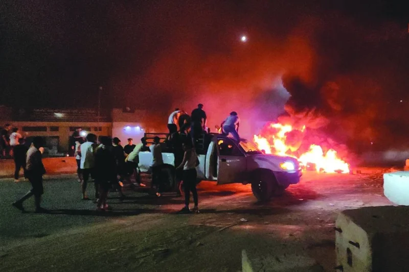
Libyans burn tyres as they protest in Tripoli yesterday, following an informal meeting between the country’s foreign minister and her Israeli counterpart. 