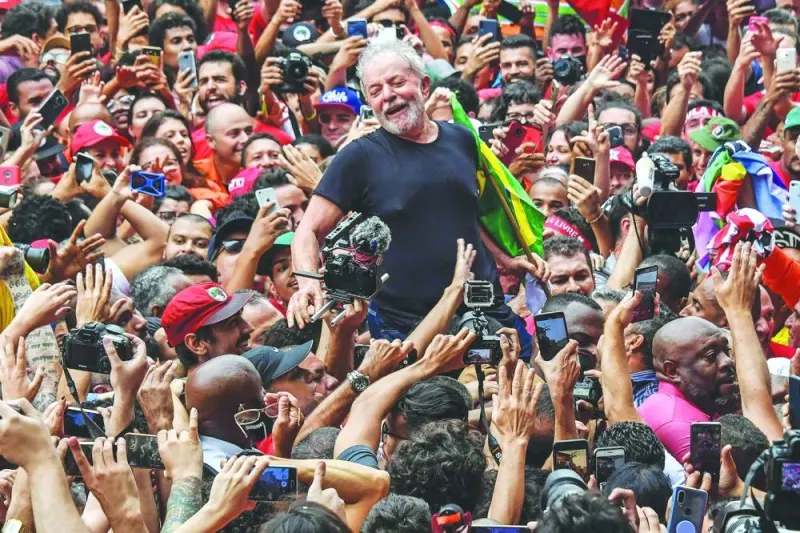 
Brazilian President Luiz Inacio Lula da Silva is carried on the shoulders through the crowd of supporters during a gathering outside the metalworkers’ union building in Sao Bernardo do Campo, in metropolitan Sao Paulo in 2019. (AFP) 