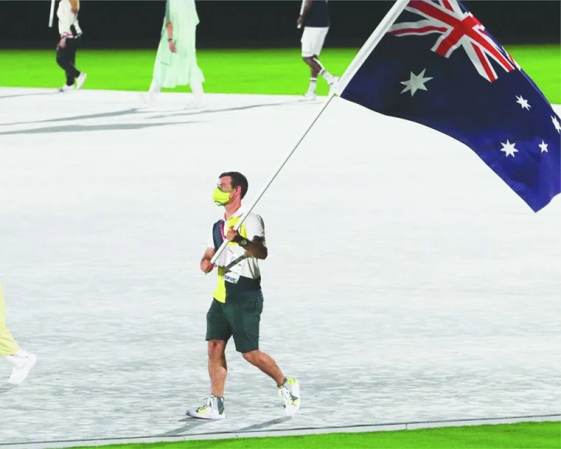 Sailing star Mat Belcher leads the Australia contingent at the Tokyo Olympic Games 2020 Closing Ceremony in August 2021. 
(@AUSOlympicTeam)