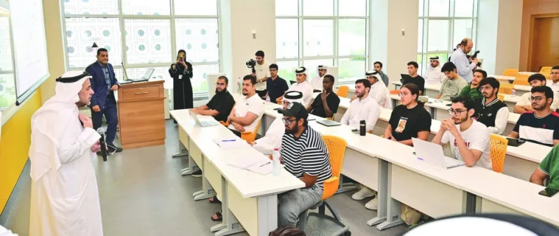 Dr al-Ansari interacts with students at the College of Engineering.