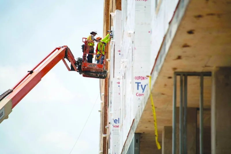 
Construction workers put up house wrap in Houston. US job growth picked up in August, but the unemployment rate jumped to 3.8% and wage gains moderated, suggesting that labour market conditions were easing and cementing expectations that the Federal Reserve will not raise interest rates this month. 