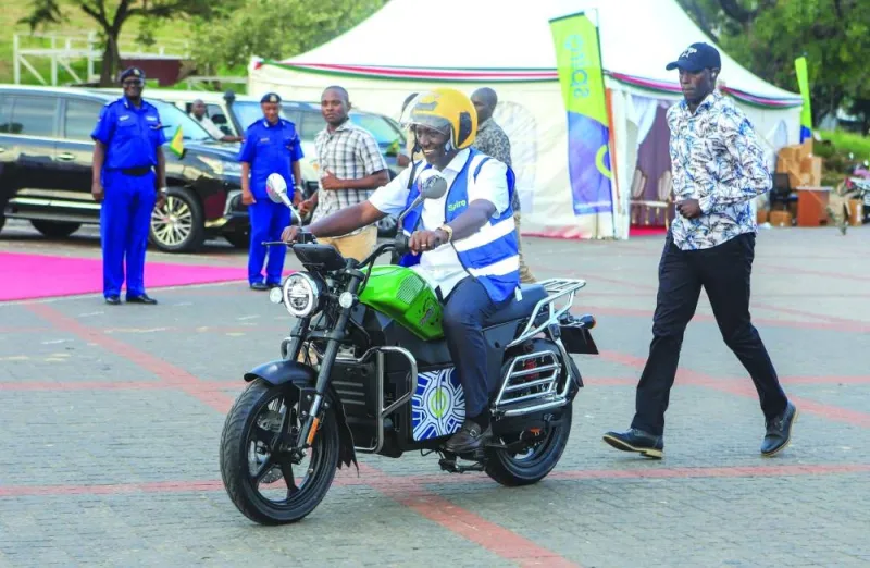 
Kenya’s President William Ruto uses an electric motorcycle during the national launch of an electric motorcycle project dubbed e-boda boda at Kenyan coastal city of Mombasa, yesterday. 
