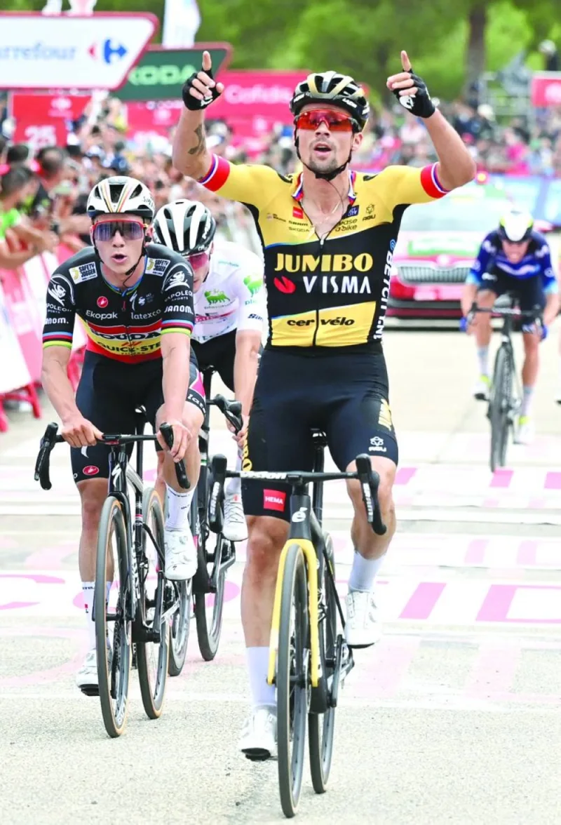 Stage winner Team Jumbo’s Primoz Roglic celebrates crossing the finish line during the Stage 8 of the La Vuelta in Castalla on Saturday. (AFP)