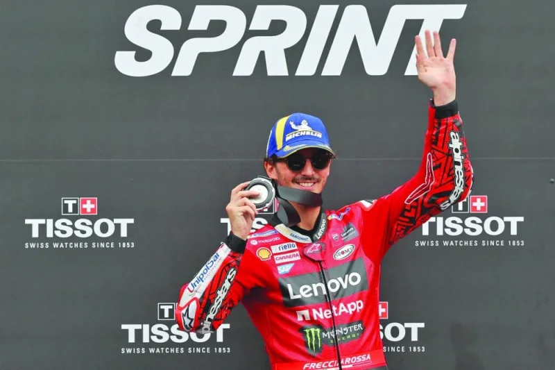 Second placed Ducati Italian rider Francesco Bagnaia celebrates on the podium after the MotoGP sprint race of the Catalunya Moto Grand Prix at the Circuit de Catalunya in Montmelo, Barcelona, on Saturday. (AFP)