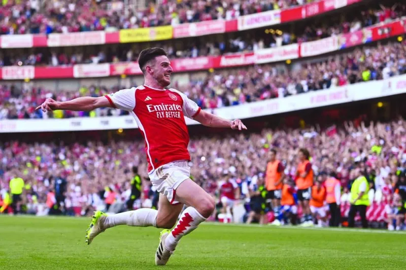 Arsenal’s English midfielder Declan Rice celebrates after scoring their late second goal during the English Premier League match against Manchester United at the Emirates Stadium in London on Sunday. (AFP)