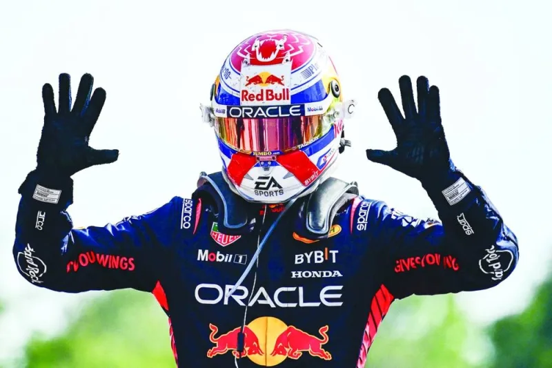 Red Bull Racing’s Dutch driver Max Verstappen celebrates after winning the Italian Formula One Grand Prix race at Autodromo Nazionale Monza circuit on Sunday. Verstappen won a record-breaking 10th straight race after coming out on top at the Italian Grand Prix in a Red Bull one-two at Monza. (AFP)