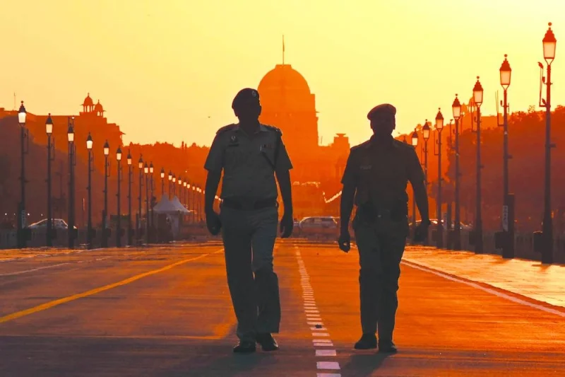 
Police personnel patrol along a street in front of India’s presidential palace, Rashtrapati Bhawan, in New Delhi ahead of the commencement of G20 India summit. 