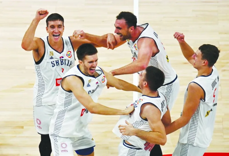 Serbia players celebrate after winning the FIBA World Cup semi-final against Canada at Mall of Asia Arena, Manila, Philippines, on Friday. (Reuters)