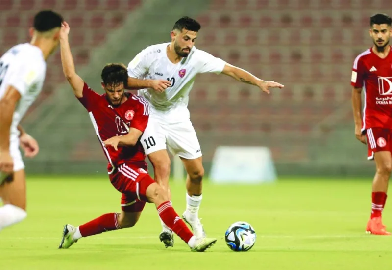 An action from the Ooredoo Cup match between Al Arabi and Muaither at the Grand Hamad Stadium on Saturday.