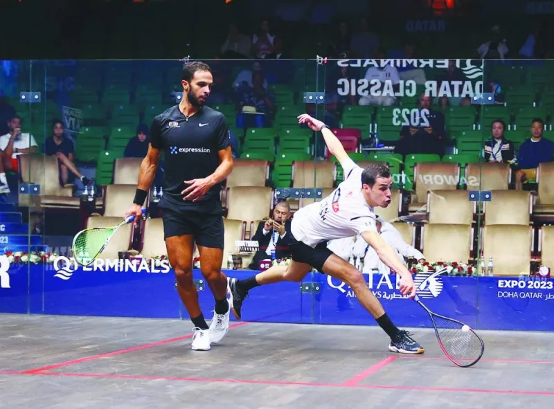Ali Farag of Egypt in action against compatriot Mohamed Abouelghar during their Qterminal Qatar Classic clash at the Khalifa International Tennis and Squash Complex in Doha yesterday. 