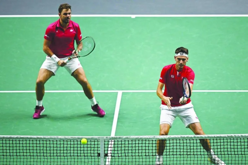 Switzerland’s Marc-Andrea Huesler (right) and Stan Wawrinka in action against France’s Nicolas Mahut and Edouard Roger-Vasselin during their doubles Davis Cup finals Group B match at the AO Arena in Manchester on Tuesday. (AFP)