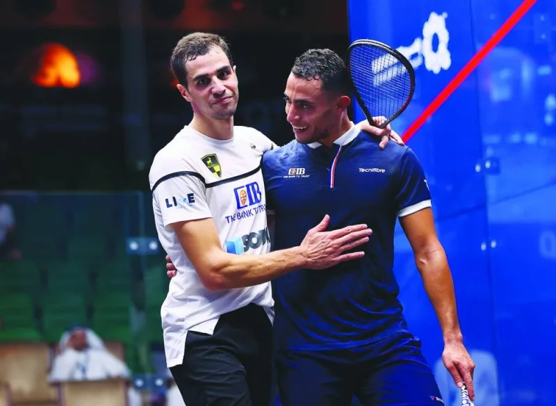 Top seed Ali Farag (left) of Egypt is seen with compatriot Fares Dessouky after their third-round match at QTerminals Qatar Classic at Khalifa International Tennis and Squash Complex in Doha on Tuesday.  Tinne Gilis of Belgium in action against fourth seed Joelle King of New Zealand on Tuesday.