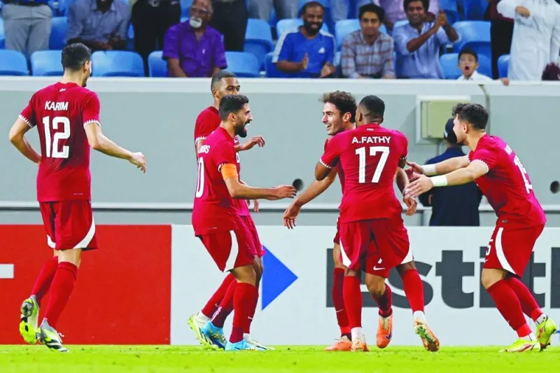 Qatar’s forward Ahmed Alaaeldin (third right) celebrates with teammates after scoring against Russia in a friendly match at the Al Janoub Stadium in Al Wakra on Tuesday. (AFP)