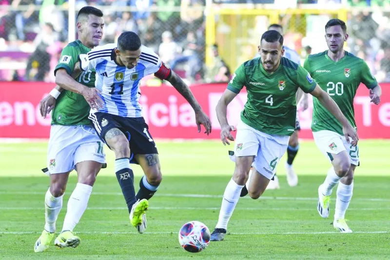 
Bolivia’s midfielder Moises Villarroel (left) fights for the ball with Argentina’s forward Angel Di Maria during the 2026 FIFA World Cup South American qualifiers at the Hernando Siles stadium in La Paz. (AFP) 