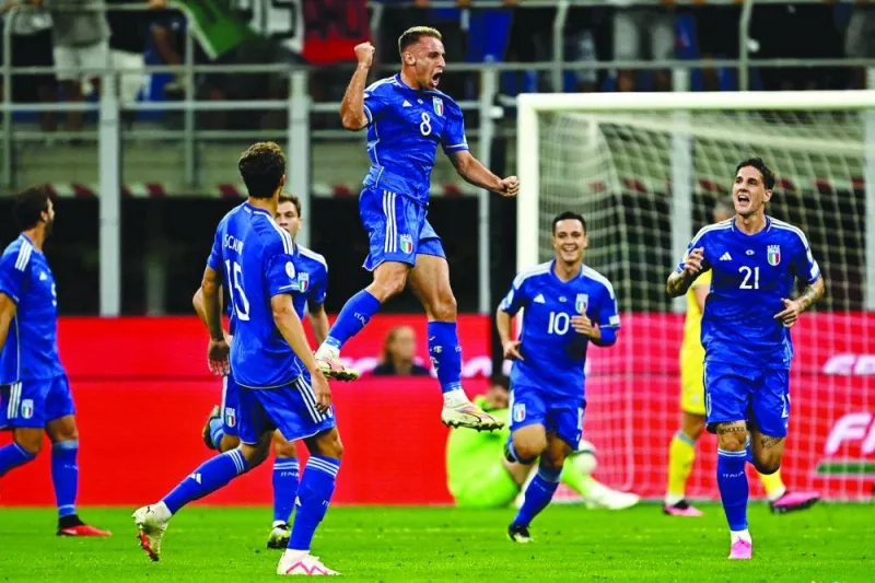 
Italy’s midfielder Davide Frattesi (centre) celebrates after scoring against Ukraine during the Euro 2024 Group C qualifying match at Stadio San Siro in Milan on Tuesday. (AFP) 