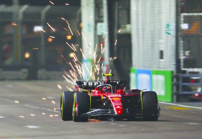 
Sparks fly from Carlos Sainz’s Ferrari’s during a practice session in Singapore.  