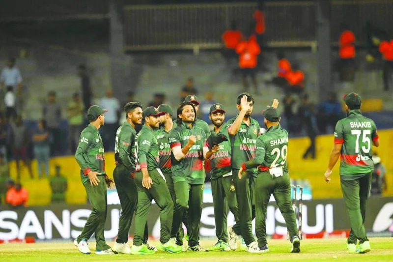 Bangladesh’s cricketers celebrate their win against India at the Asia Cup at R Premadasa Stadium in Colombo on Friday. (AFP)