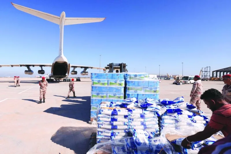Military personnel supervise the arrival of aid supplied by the UAE for survivors of the floods that submerged Libya’s eastern city of Derna, at the airport of Benghazi, on Saturday.