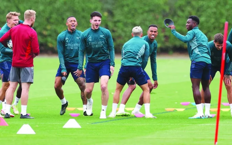 Arsenal’s players attend a training session on Tuesday, on the eve of their Champions League match against PSV Eindhoven. (AFP)