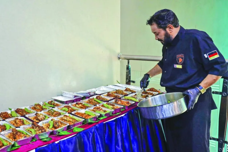 
A volunteer chef prepares meals for people displaced from eastern Libya following a deadly flood and housed in Tripoli, at a kitchen facility in the capital, yesterday. 