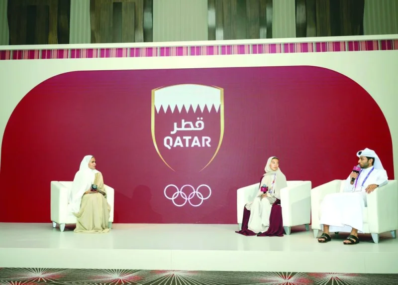 Qatar athletes’ Abdulla al-Tamimi and Hind al-Mudhaka speak at a panel discussion moderated by Director of the Marketing and Communications Department of QOC Sheikha Asma al-Thani on Monday.