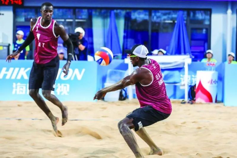 Qatar’s beach volleyball pair Cherif Younousse (left) and Ahmed Tijan in action during the semi-finals against Kazakhstan’s Sergey Bogatu and Dmitriy Yakovlev at the Hangzhou Asian Games in Ningbo, China, on Tuesday.