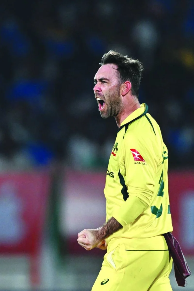 Australia's Glenn Maxwell celebrates after taking the wicket of India's Shreyas Iyer during the third and final one-day international (ODI) cricket match between India and Australia at the Saurashtra Cricket Association Stadium in Rajkot on September 27, 2023. (Photo by Punit PARANJPE / AFP)