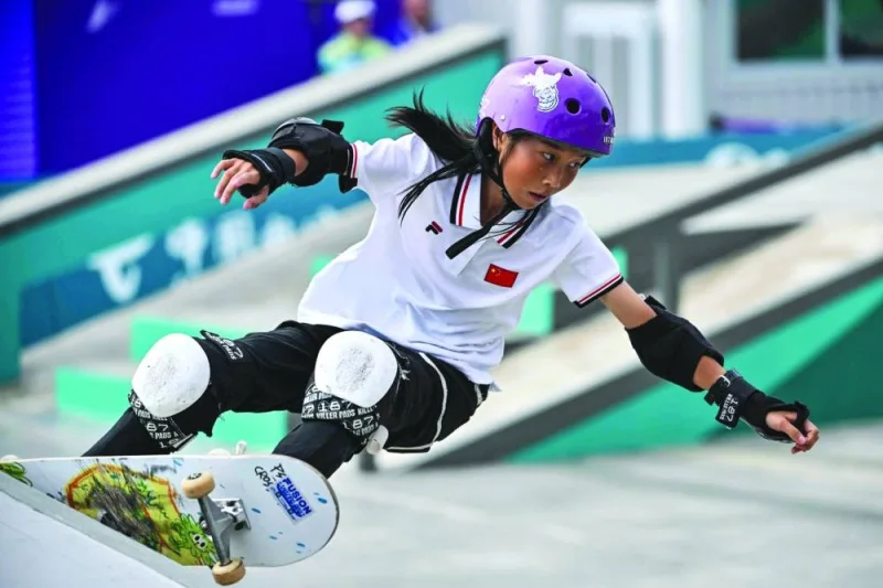 
China’s 13-year-old Cui Chenxi competes in the women’s street skateboarding final during the Asian Games in Hangzhou. (AFP) 