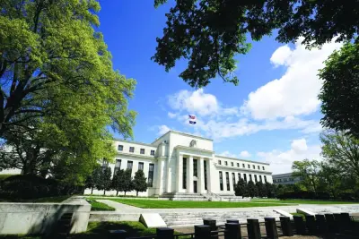 
The Federal Reserve building is set against a blue sky in Washington. Some economists believe the economy’s resilience combined with high inflation could give the Fed ammunition to raise interest rates again in November. 