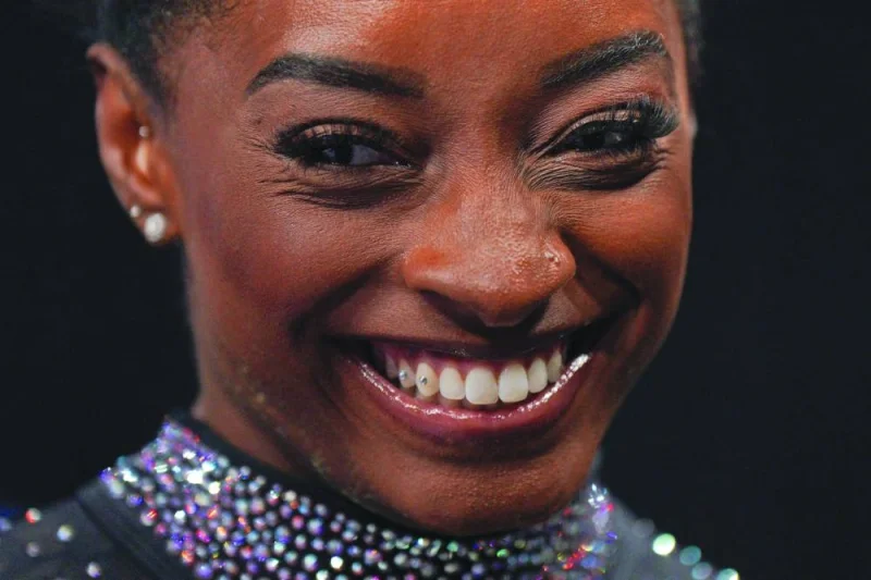 Gymnast Simone Biles smiles on the final day of women&#039;s competition at the 2023 US Gymnastics Championships at the SAP Center in San Jose, California, on August 27, 2023. The queen of gymnastics, Biles, has got rid of her "twisties" and returns to the World Championships in Antwerp, Belgium, starting today after a two-year break to treat her mental health. (AFP)