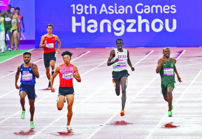 Qatar’s Ismail Abakar (right) takes part in the men’s 400m heats at the Hangzhou Asian Games in China on Friday.