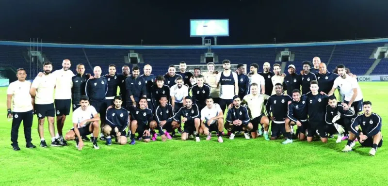 Al Sadd players and backroom staff during a training session in Namangan, Uzbekistan. 