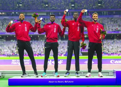 
From left: Qatar’s 4x400m relay quartet Abderrahman Samba, Ashraf Osman, Ismail Abakar and Bassem Hemeida celebrate with their silver medals on the podium in Hangzhou. 