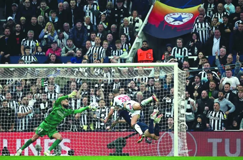 Newcastle United’s English defender Dan Burn scores the team’s second goal during the UEFA Champions League Group F match against Paris Saint-Germain at St James’ Park. (AFP)