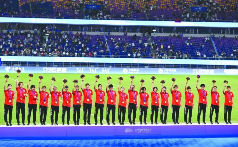 Japan’s women team poses during the award ceremony after winning the football gold medal at the Asian Games in Hangzhou, China, on Friday. (AFP)